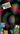 Promotional graphic for 'RSD Black Friday' featuring a dark, swirling multicolour background and several small album cover thumbnails scattered near the bottom.